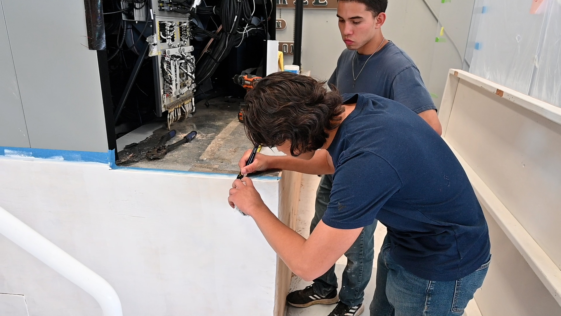 Students work on building a flight simulator for the Rowland Freedom Center in Vacaville, California.