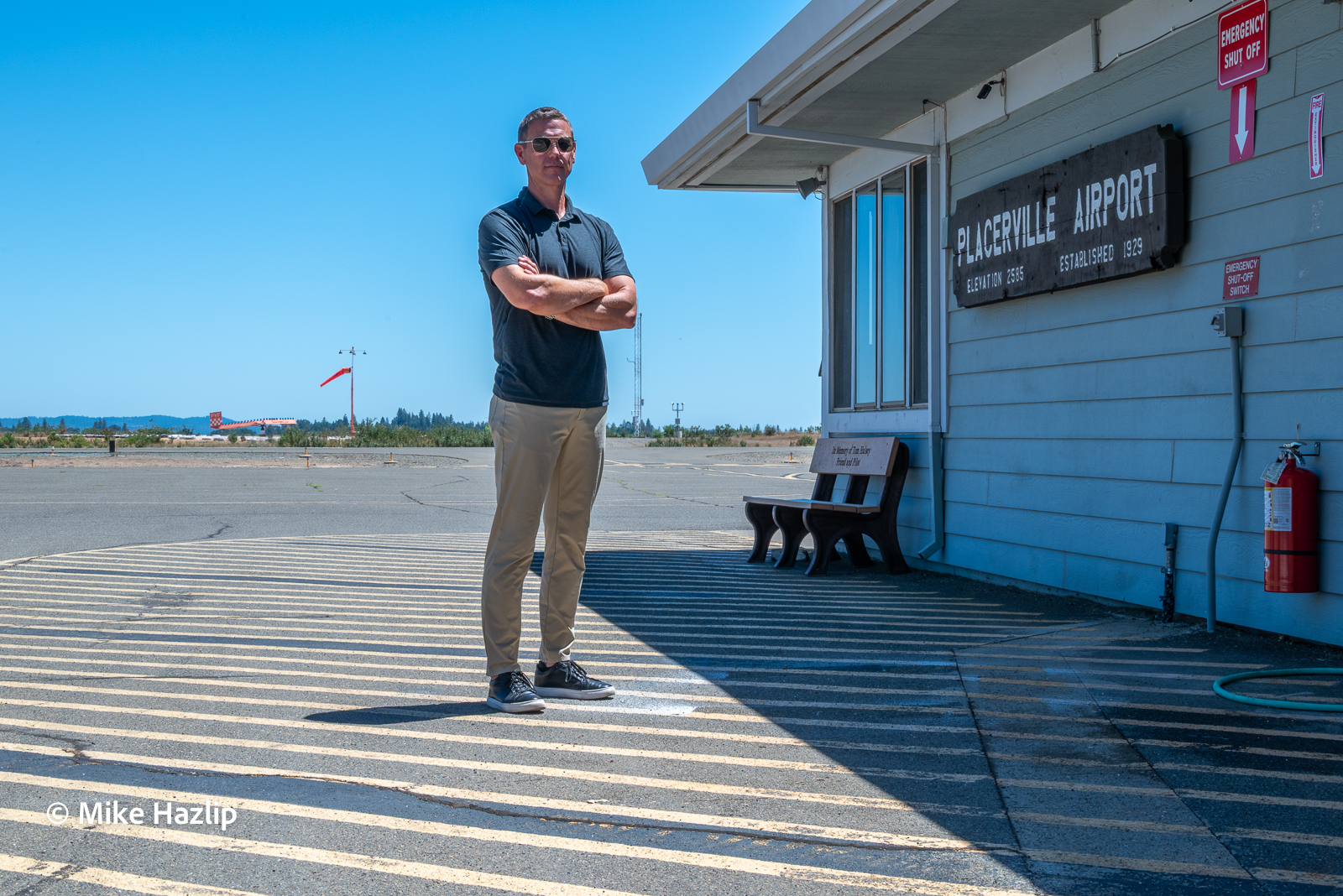Dale Lusby stands near the office building of Placerville Airport.